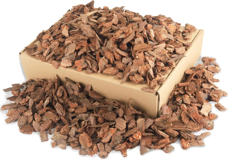 Orchid bark mulch in natural wood chips, loose potting substrate in a cardboard tray
