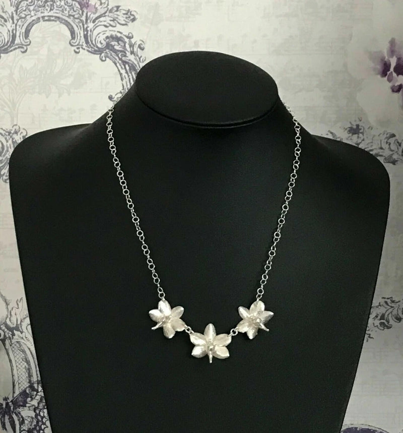 Sterling silver orchid flower necklace with three small blossoms and link chain