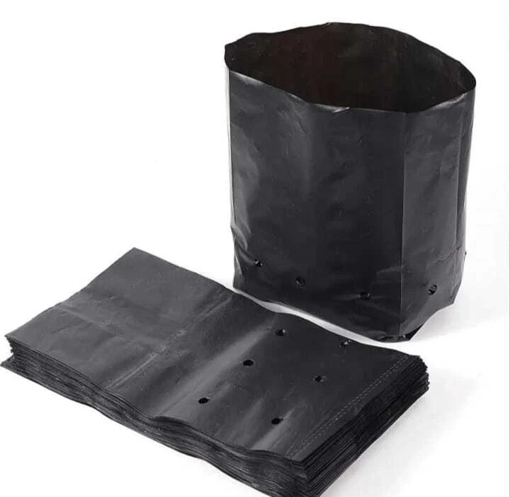 Black fabric planting grow bag with drainage holes, shown with folded matching bags