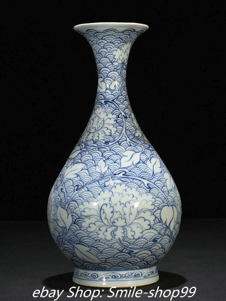 Blue and white porcelain vase with tall neck and wave cloud motif