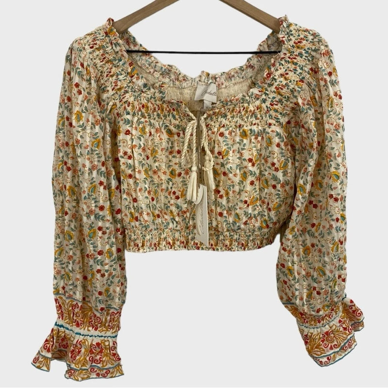Floral cropped blouse with smocked yoke and tassel tie, multicolor print, long puff sleeves