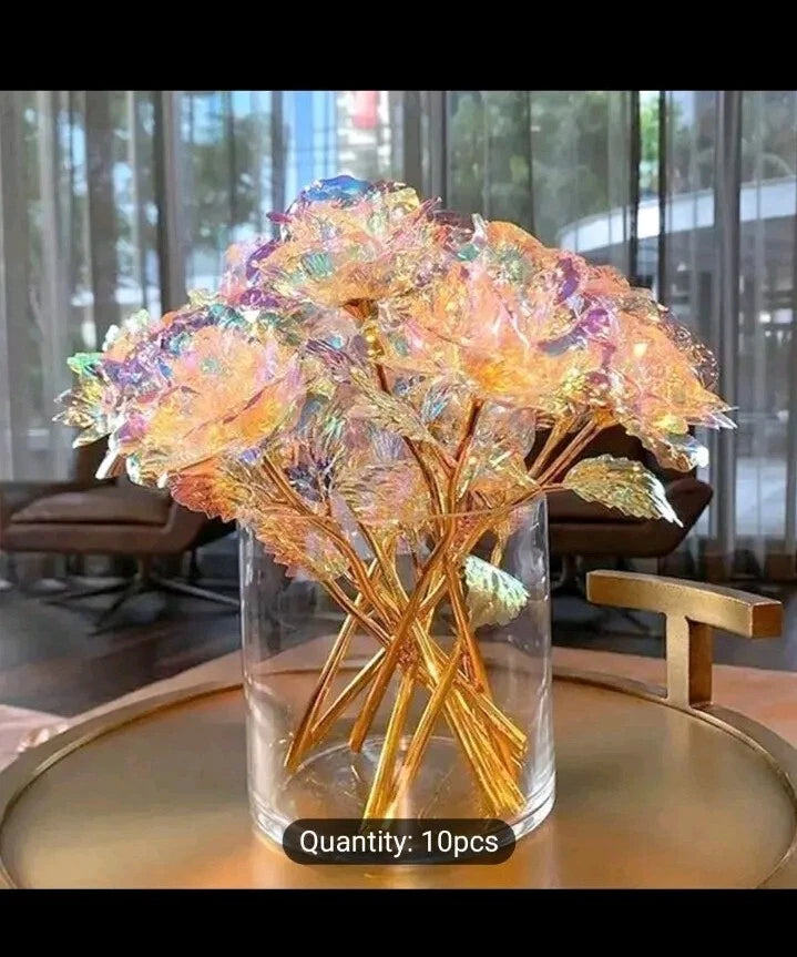 Gold foil artificial rose bouquet in clear glass vase