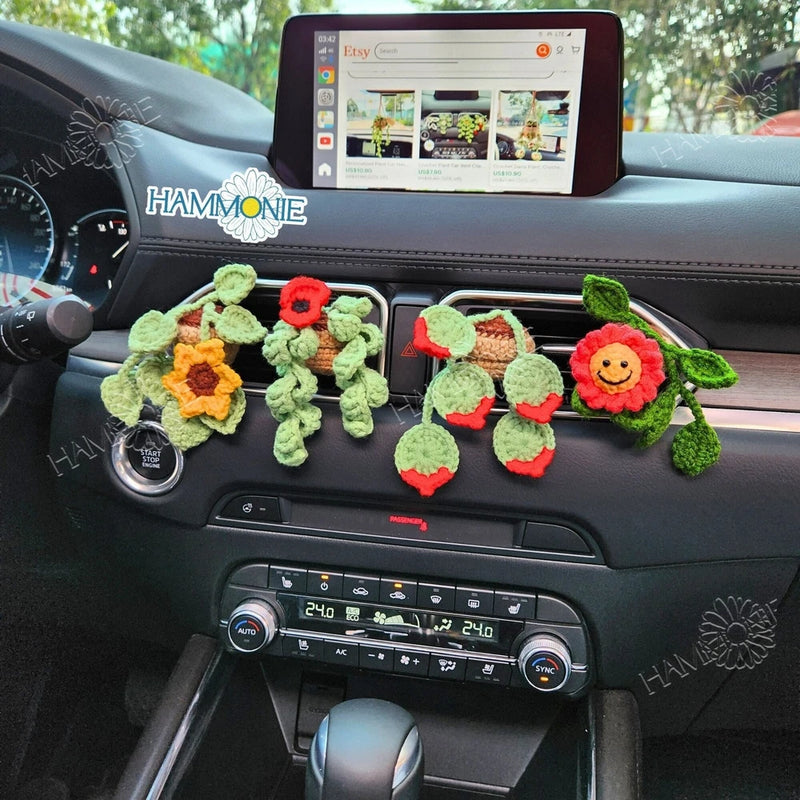 Handmade crochet flower vent clips with red poppy and yellow sunflower accents