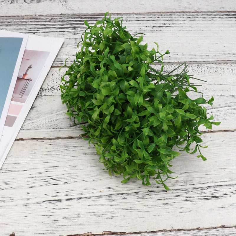 Green faux bonsai-style desktop plant ornament with dense leafy branches