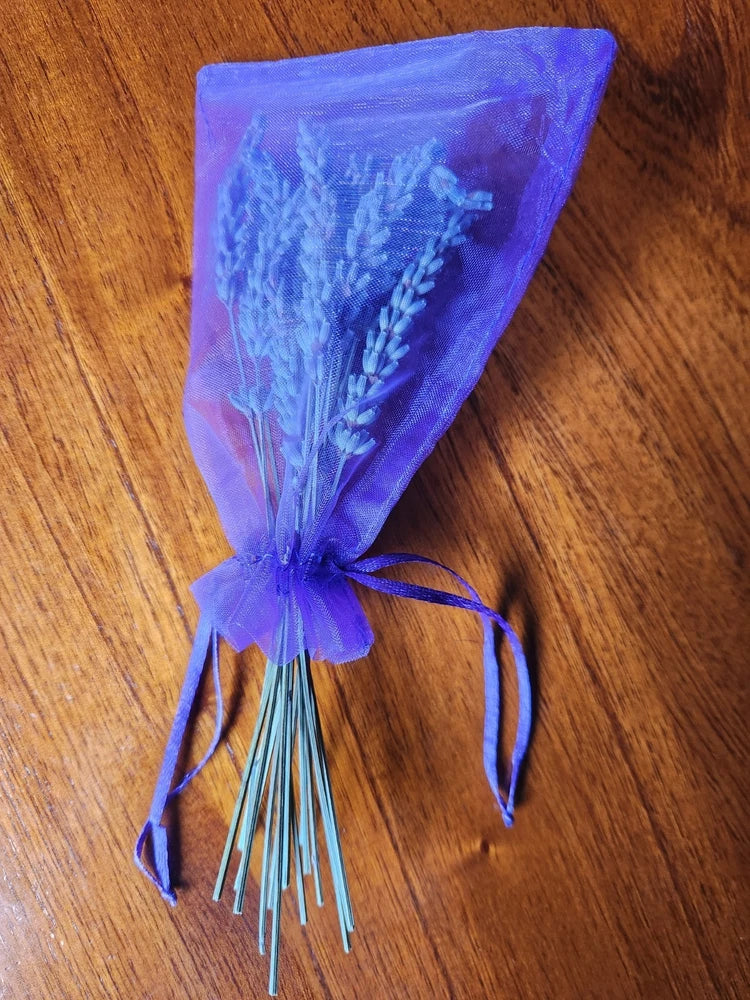 Small lavender dried flower bouquet in a purple pouch, tied with ribbon