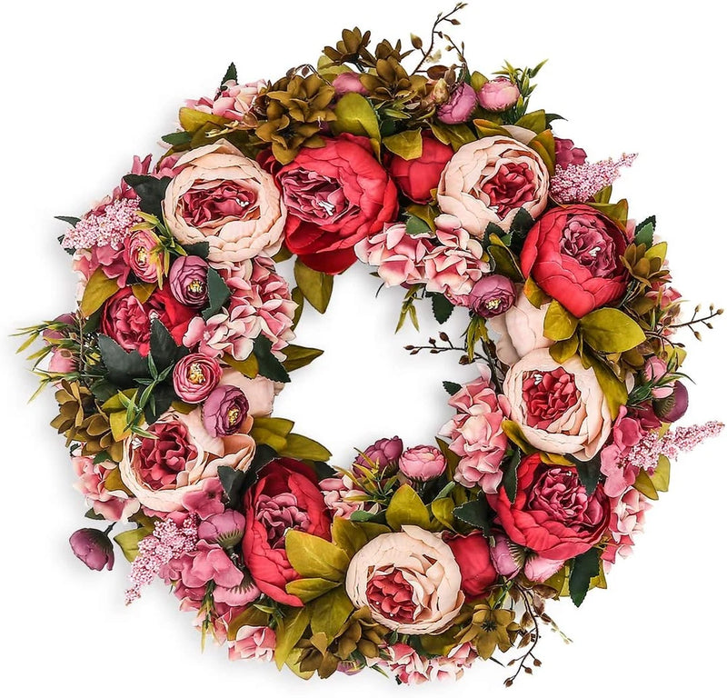 Artificial peony flower wreath with pink, red, cream blooms and green leaves