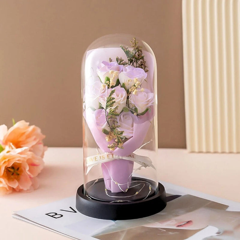 Glass dome keepsake with purple rose bouquet and LED light base