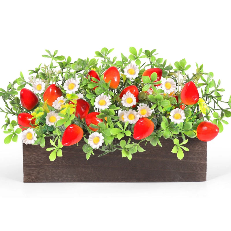 Rustic wooden box centerpiece with artificial daisies, green leaves, and red strawberry decor