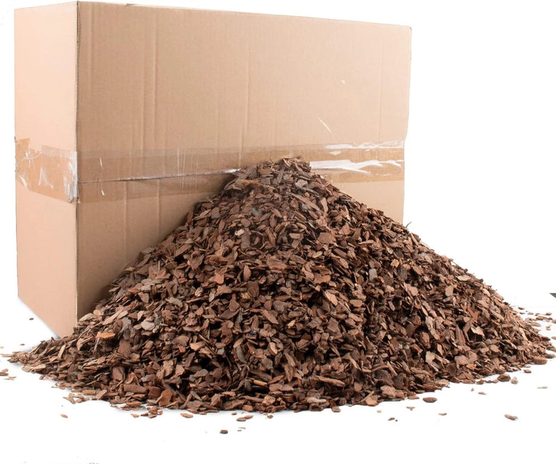 Natural orchid potting bark chips, dark brown mulch in a loose pile