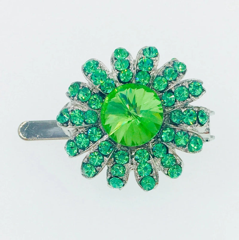 Green rhinestone sunflower hair clip with crystal center and metal barrette back