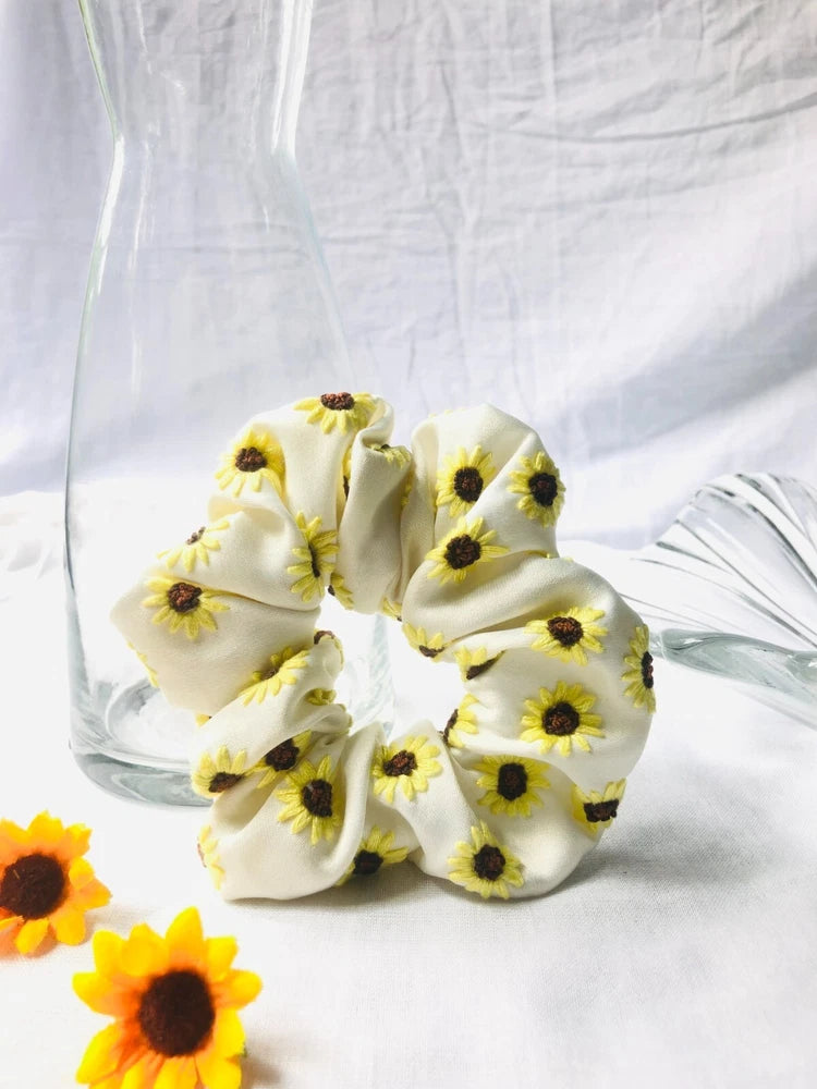 White scrunchie with sunflower embroidery and elastic hair tie loops