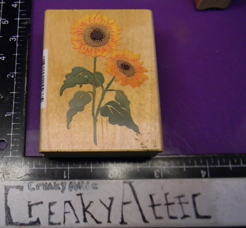 Sunflower rubber stamp on wooden block, two long-stemmed flowers in orange and yellow