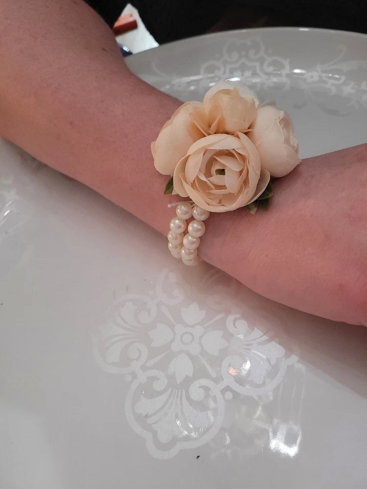 Silk wrist corsage with pale pink and white flower cluster and pearl bead band