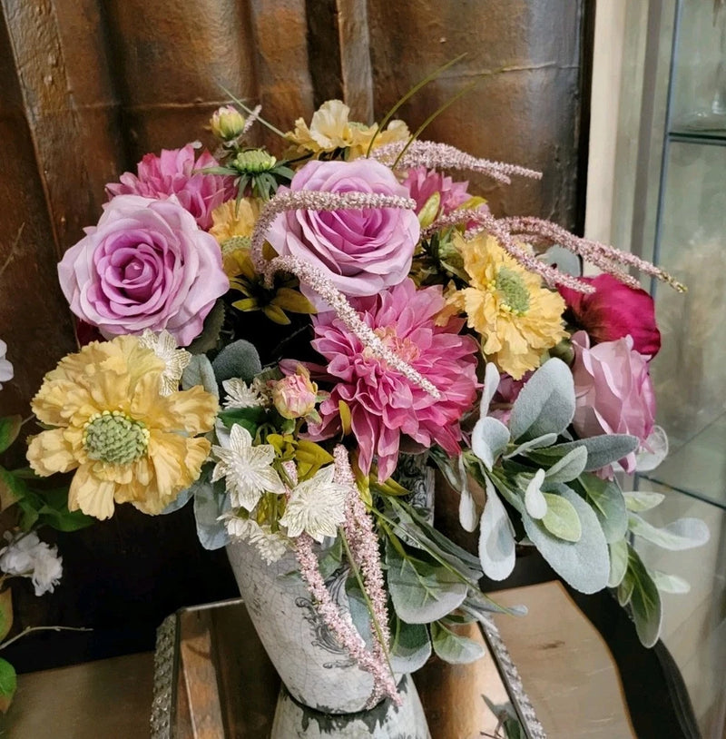 Silk faux spring bridal bouquet with pink, yellow and lavender flowers, greenery, beaded ribbon trim