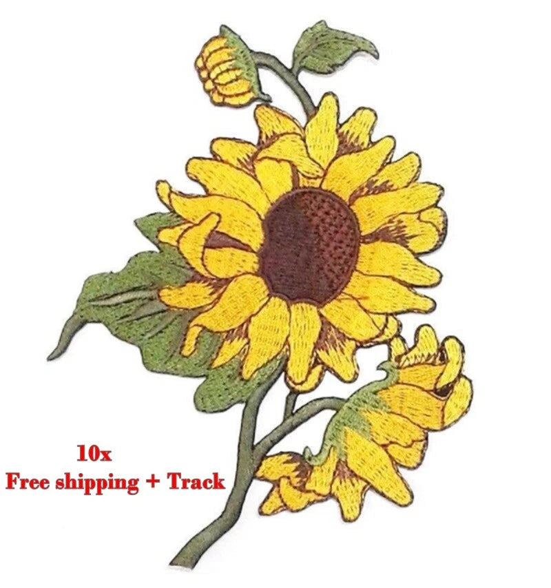 Embroidered iron-on sunflower patch with yellow petals, dark brown center, and green leaves