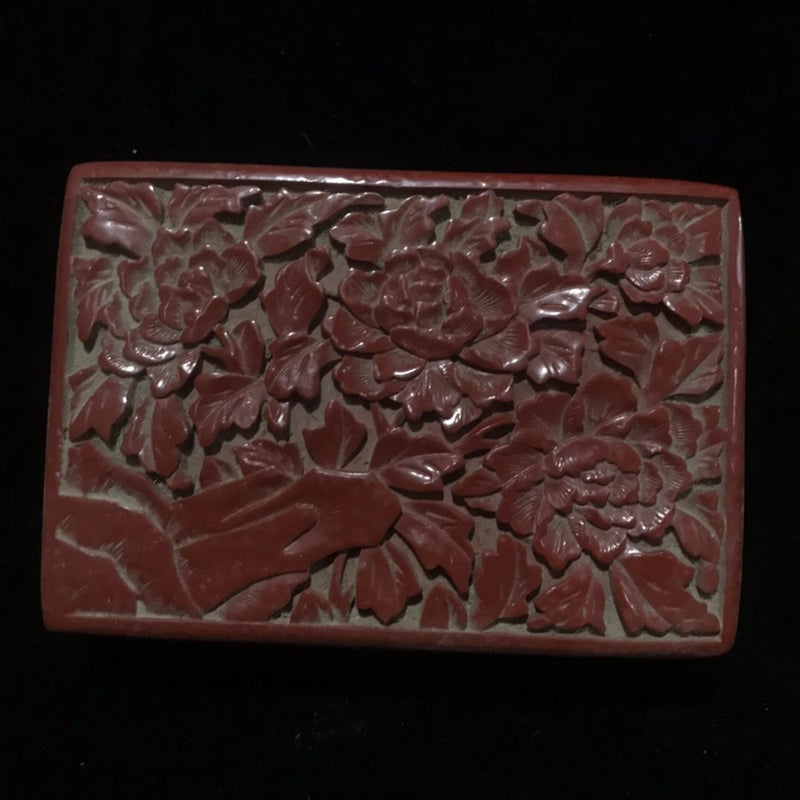 Peony carved lacquer jewelry box, rectangular with dark red floral relief