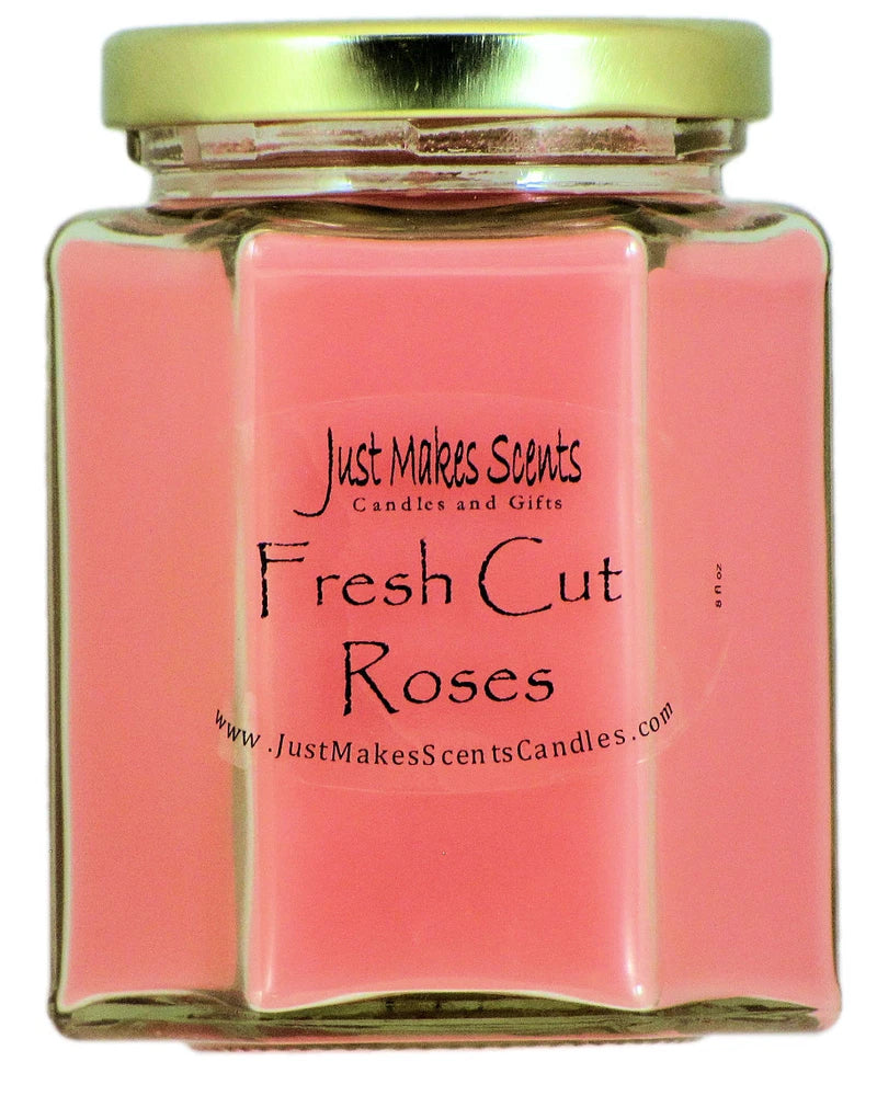 Pink rose-scented candle in hexagonal glass jar with gold lid and Just Makes Scents label.