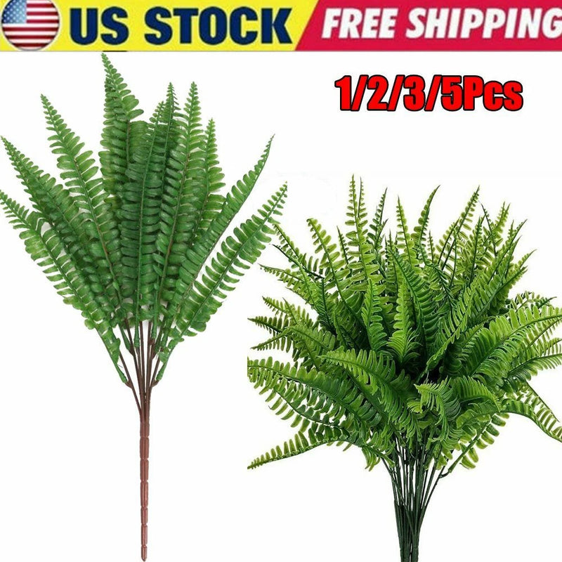 Artificial fern bush set with green fronds, brown stems in bundle