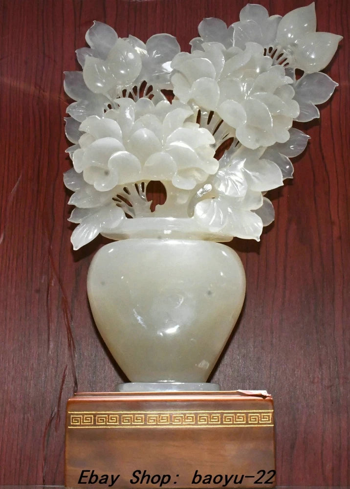 White jade-style bottle vase with hollow carved peony flower cluster on top