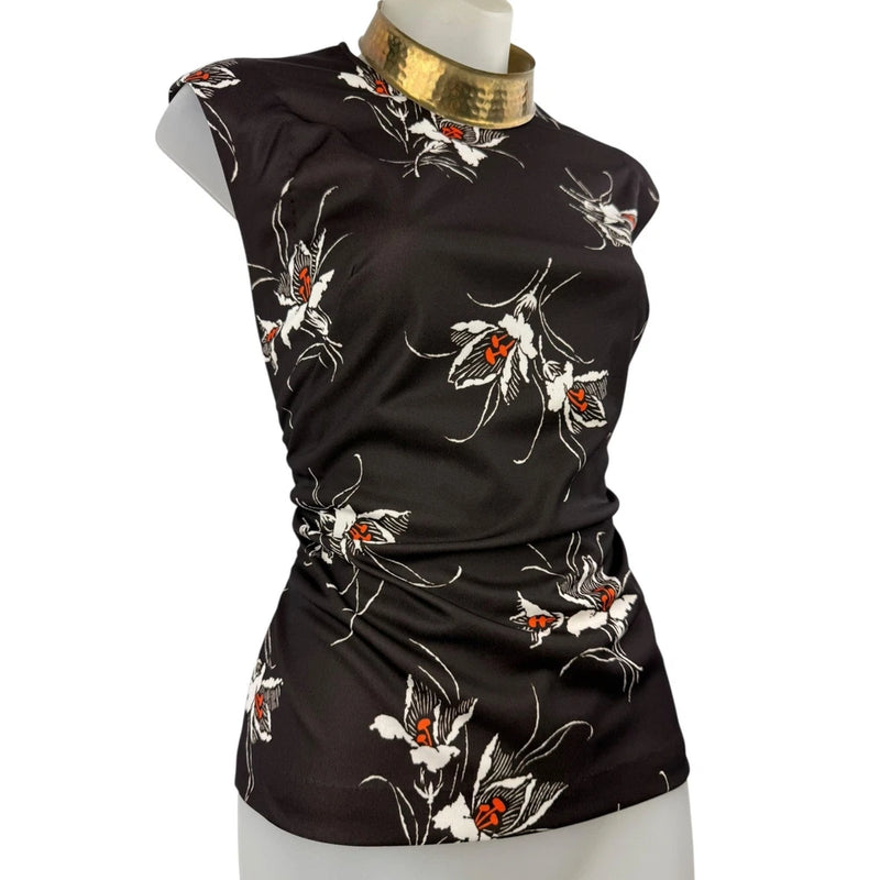 Sleeveless black blouse with colorful lily floral print