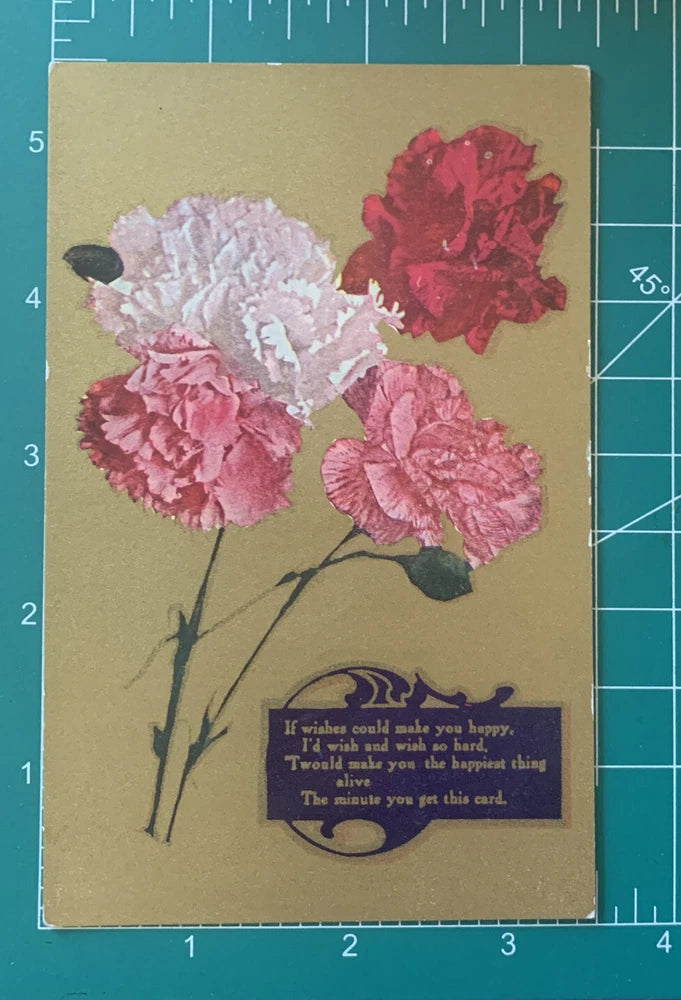 Vintage postcard with pink and red carnation flowers and a blue poem text block