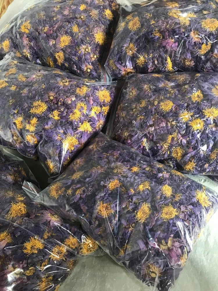 Organic dried blue lotus herbal tea flowers in sealed packets with yellow stamens