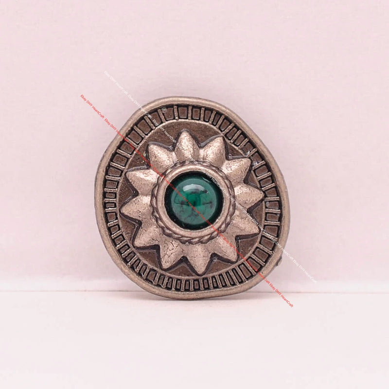 Silver sunburst leather concho with teal center jewel, round decorative button