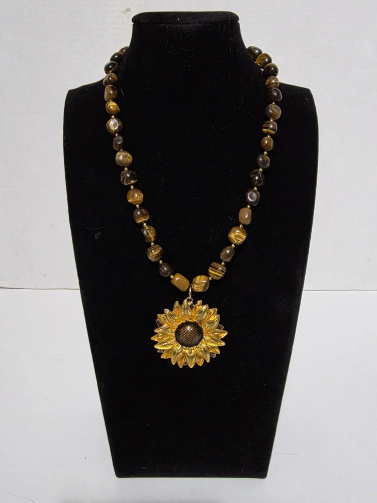 Earthy banded stone beaded necklace with golden sunflower pendant