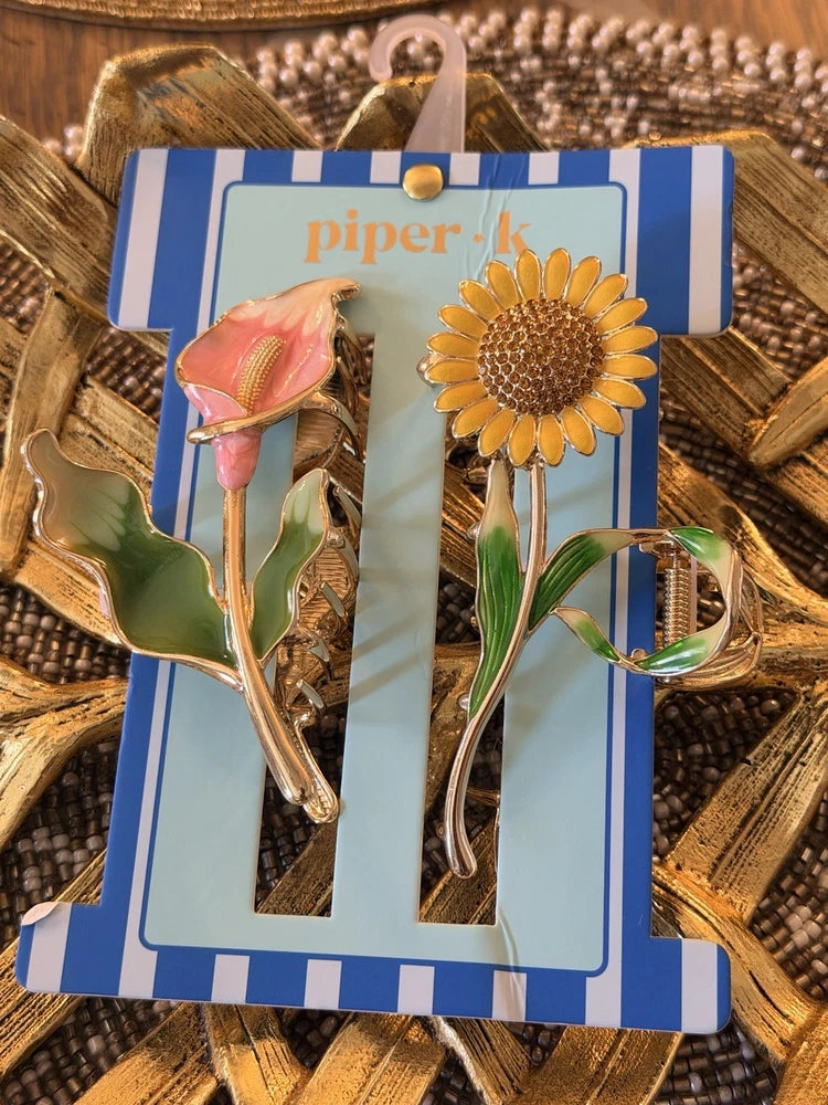 Sunflower and lily claw hair clip with gold-tone metal prongs and leaf accents