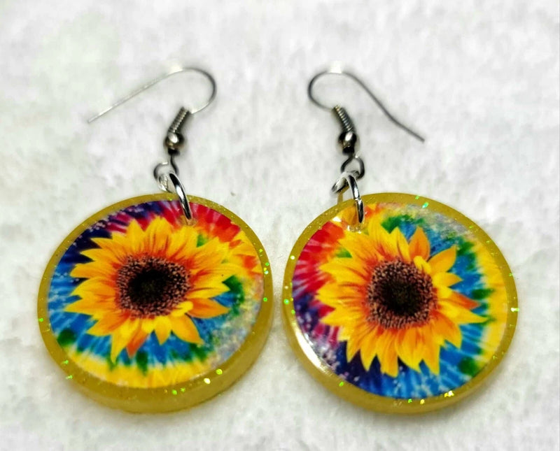 Sunflower round dangle earrings with yellow, blue, and red flower print