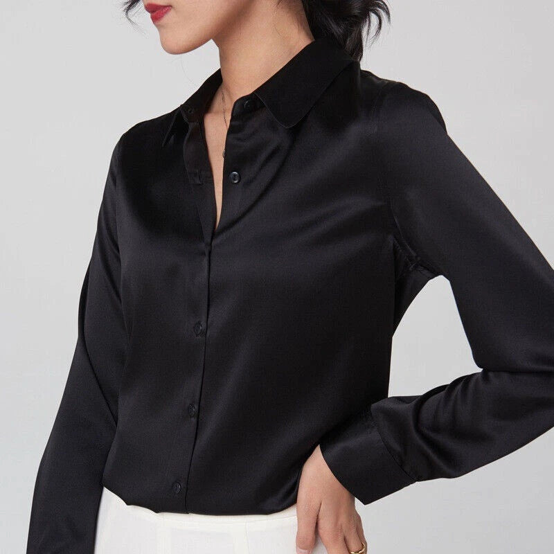 Black silk button-down blouse with long sleeves and pointed collar