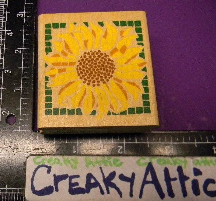 Square rubber stamp with yellow sunflower stained-glass mosaic pattern on wooden block