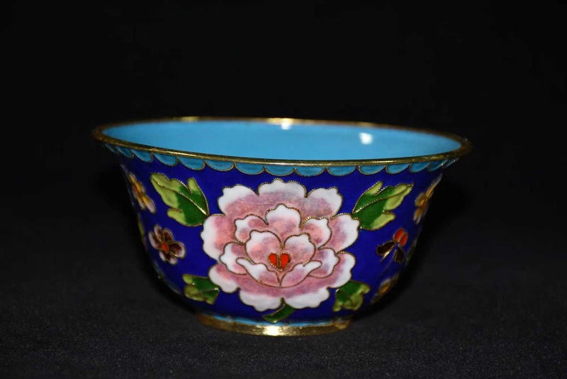Cloisonne bowl with pink peony flower and green leaf design on blue exterior