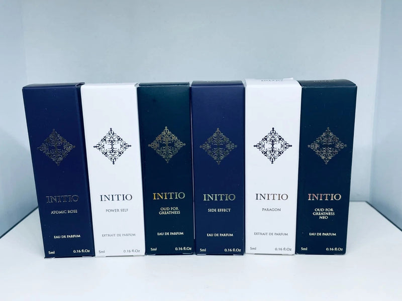 Blue-and-white boxed travel-size eau de parfum fragrance sprays, 5 ml