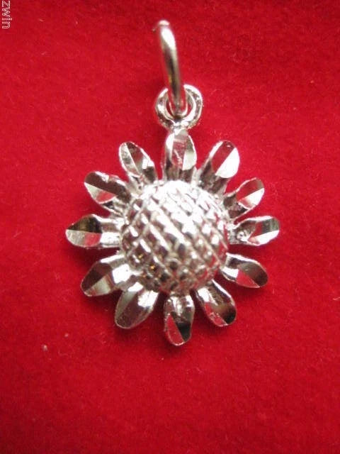 Sterling silver sunflower charm pendant with textured petals and top loop