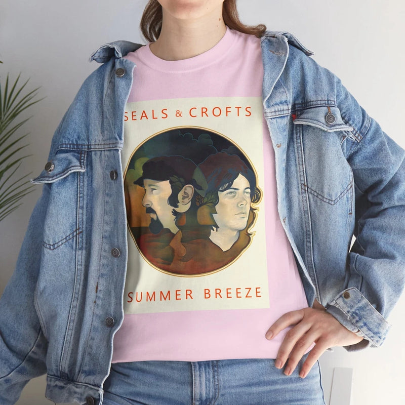 Pink T-shirt with circular faces graphic and “SUMMER BREEZE” text