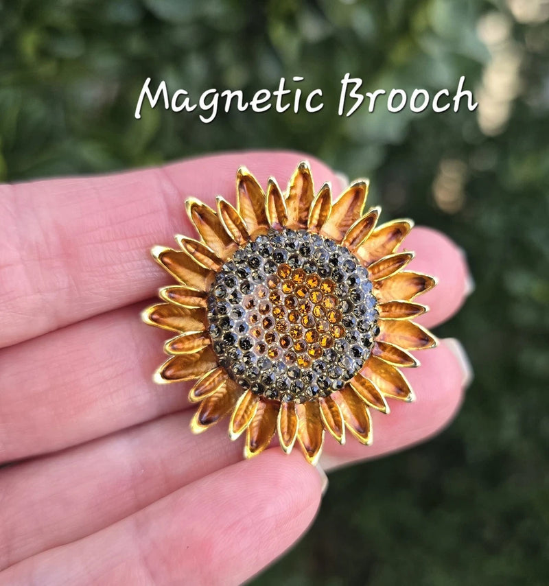 Sunflower magnetic brooch with gold-tone metal petals and crystal rhinestone center