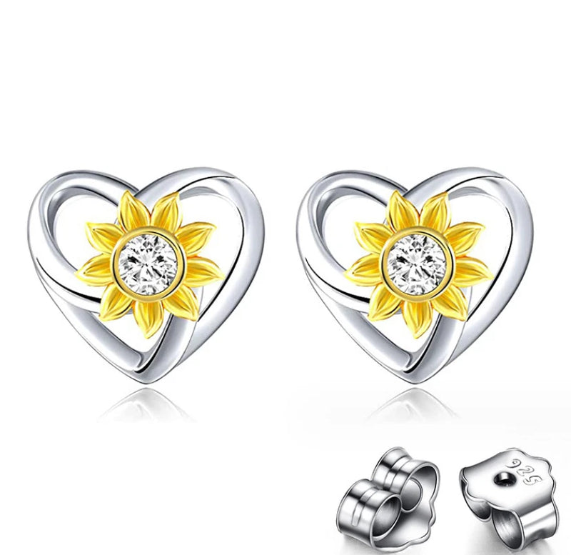 Heart-shaped sunflower stud earrings with clear CZ center and gold-tone petals on silver