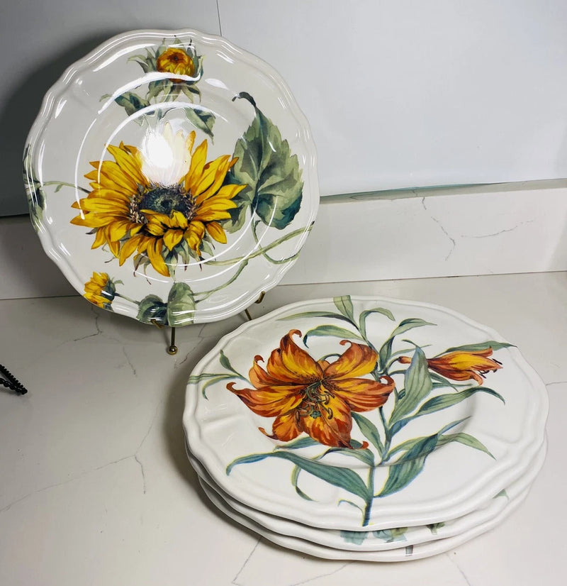 Sunflower dinner plate set with botanical floral design; white plates with stacked rim view