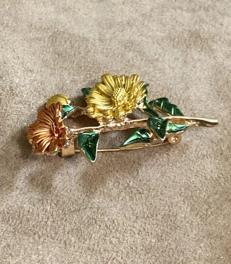 Gold-tone enamel sunflower bouquet brooch pin with green leaves and floral stems