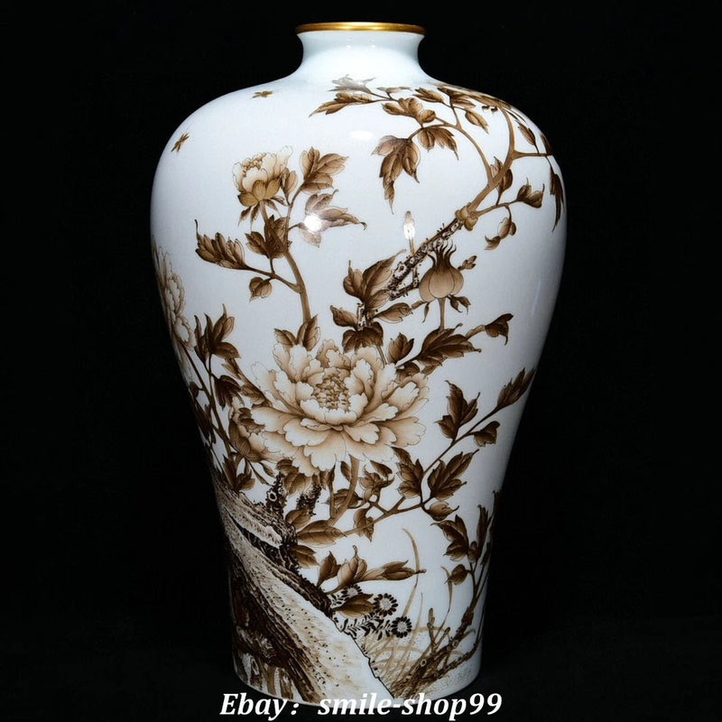 White porcelain bottle vase with brown floral panels and gold-toned rim