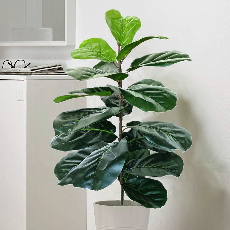 Artificial fiddle leaf fig tree with green faux leaves in a white pot