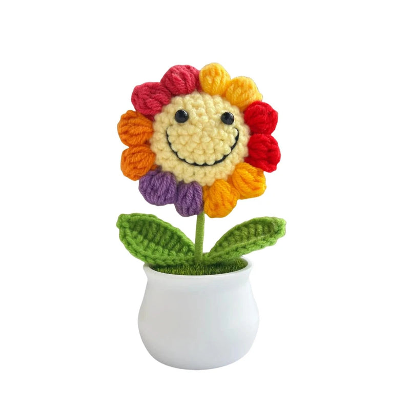 Crochet flower desk decor in white pot, multicolor petals with smiling face
