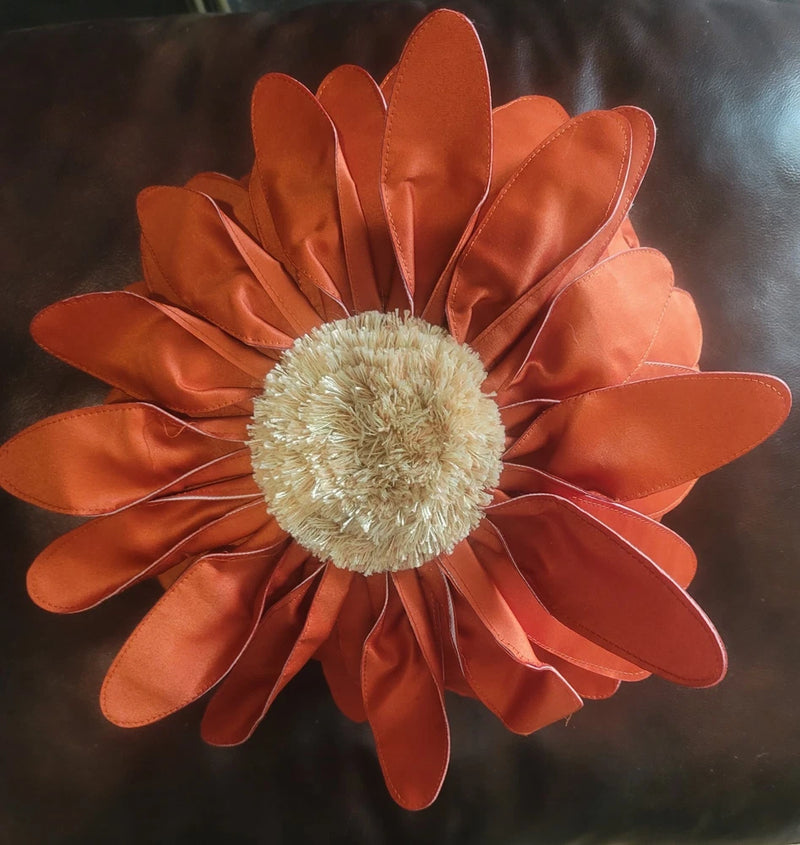 Orange sunflower throw pillow with layered satin petals and fuzzy light center