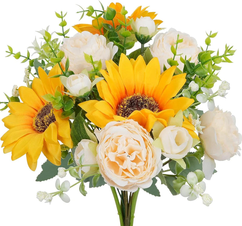 Artificial flower bouquet with orange sunflowers, white blossoms, and green leaves