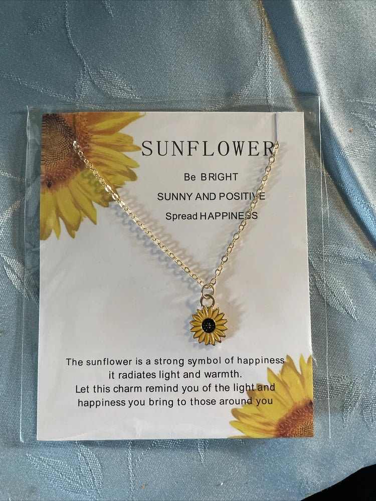 Gold-tone sunflower pendant necklace with chain and small flower charm