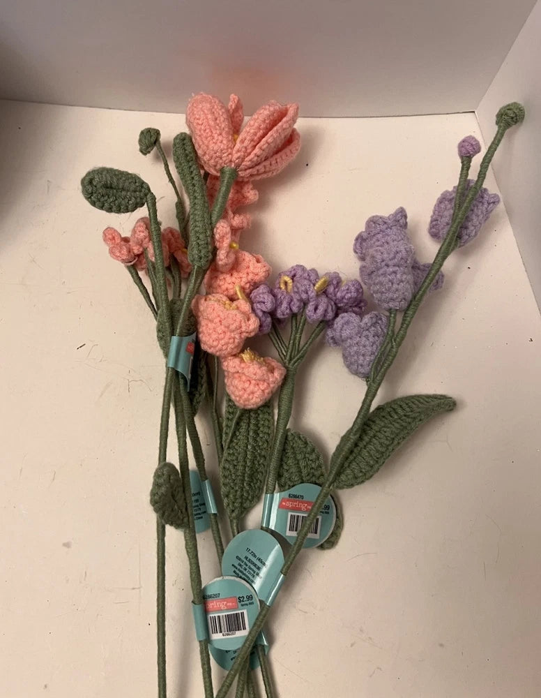 Lot of 6 crochet flowers with long stems, pink and lavender blooms, green leaves.