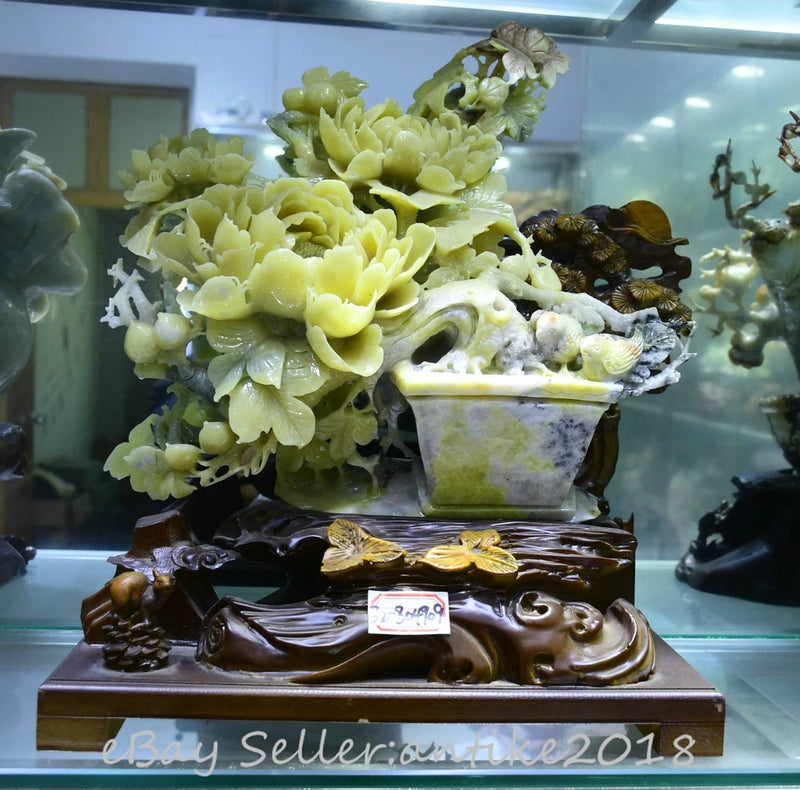 Carved pale green peony flower pot statue with bird figurine on ornate base