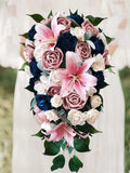 Pink and navy cascading bridal bouquet with roses, lilies, and greenery