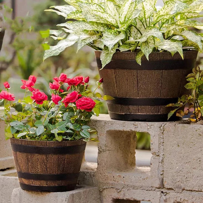 Garden whiskey bucket style flowerpot planter, dark wood barrel with green foliage and flowers